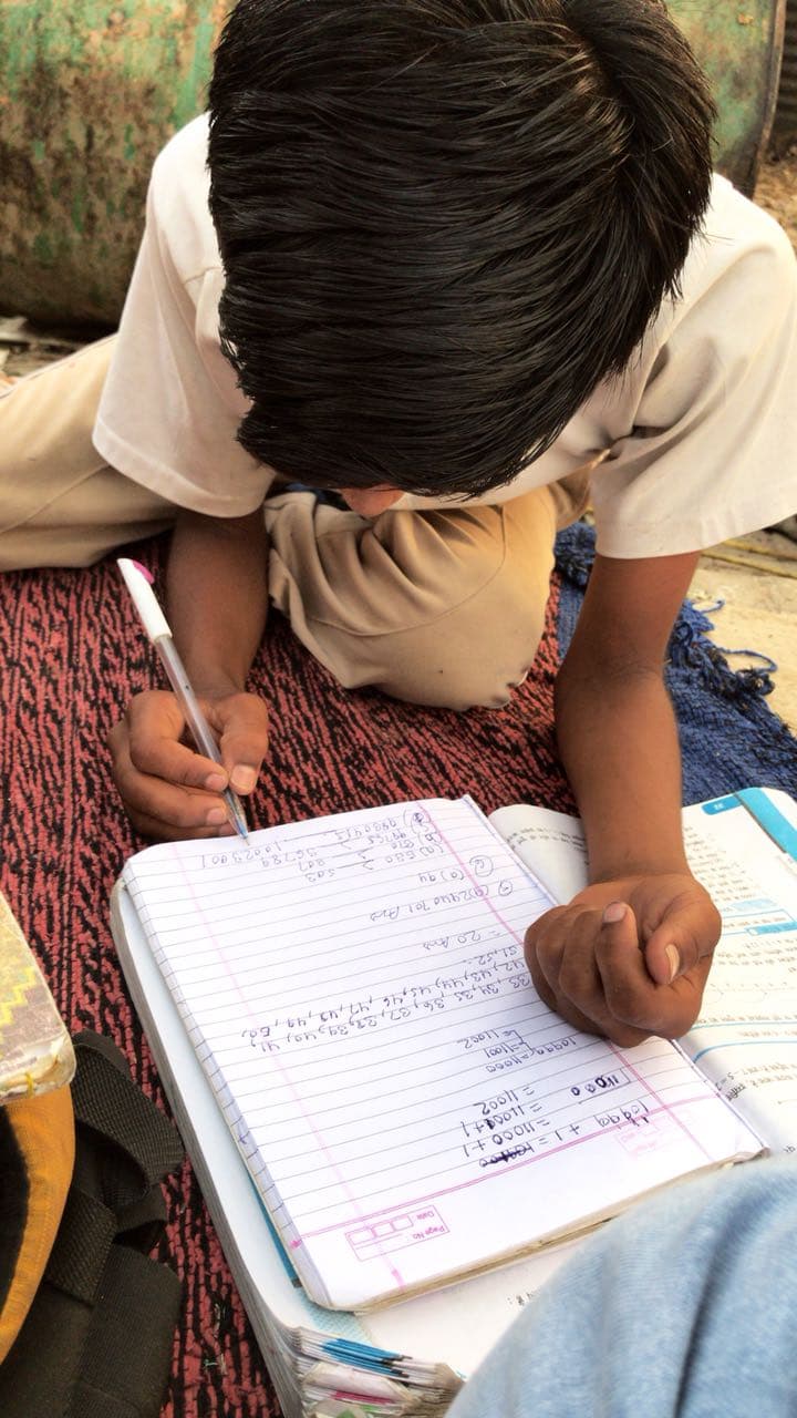 Child writing in a notebook